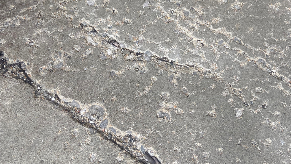 Cracked concrete that needs repair